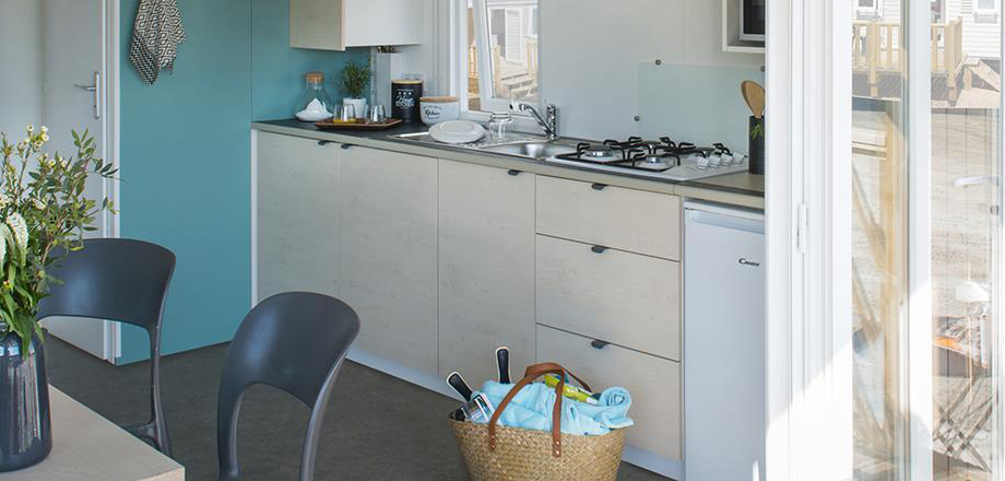 Kitchen area of the Loggia Bay mobile home, for rent at Les Amandiers campsite
