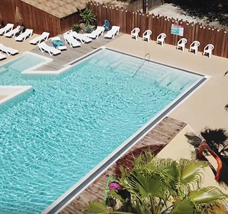 Aerial view of the aquatic area of the Les Amandiers campsite and its swimming pool.